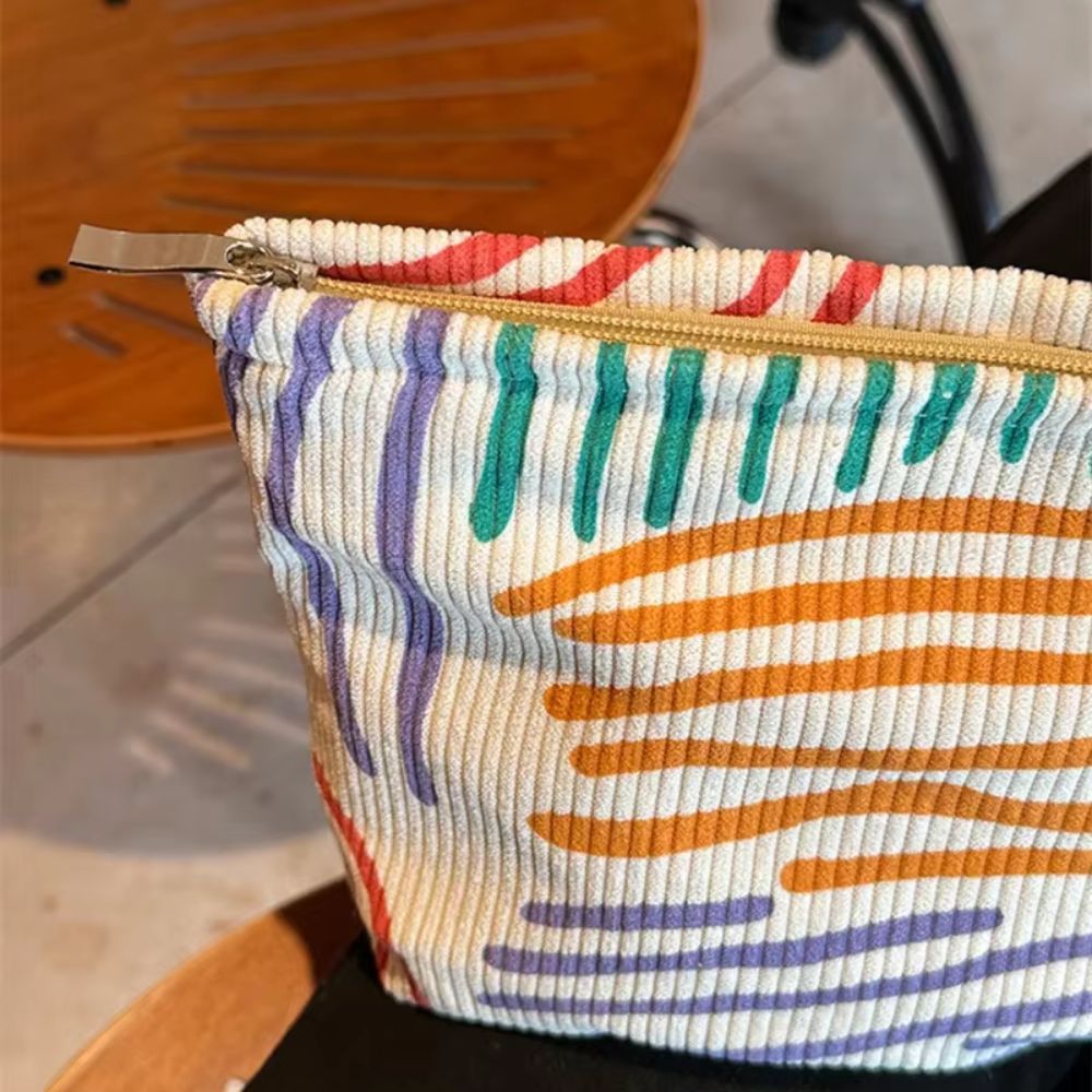 trousse de maquillage en velours rayé coloré