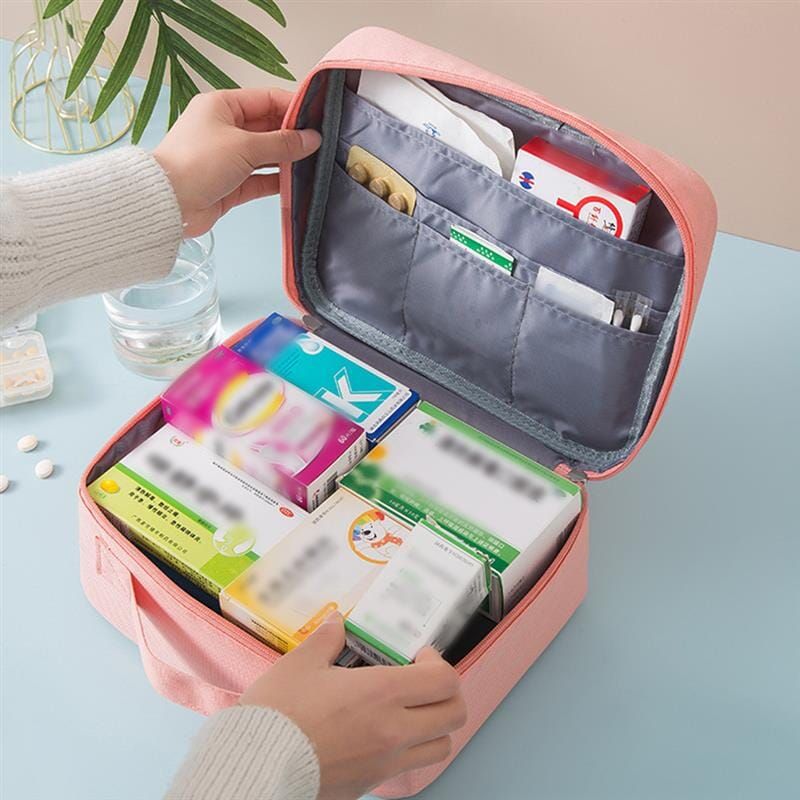 trousse pharmacie de voyage rose